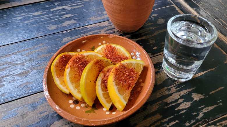 Mezcal with slices of lemon