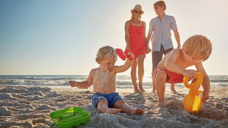 Kids building sand castle 