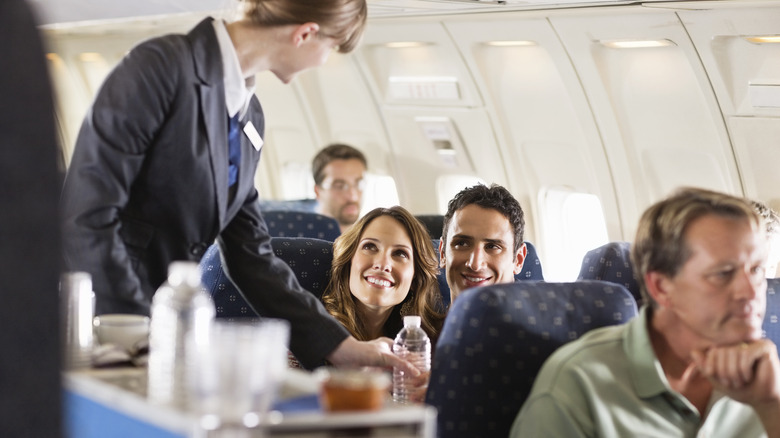 Couple being polite to flight attendant