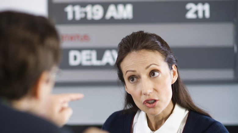 Passenger arguing with airport staff