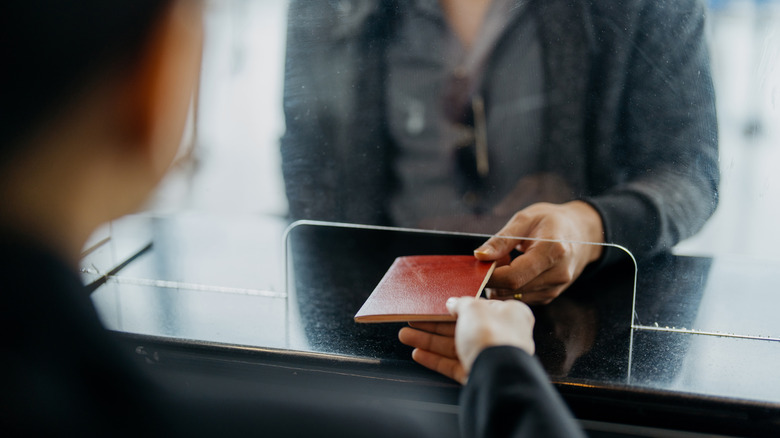 Traveler presenting passport at airport