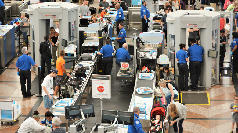 Passengers going through security