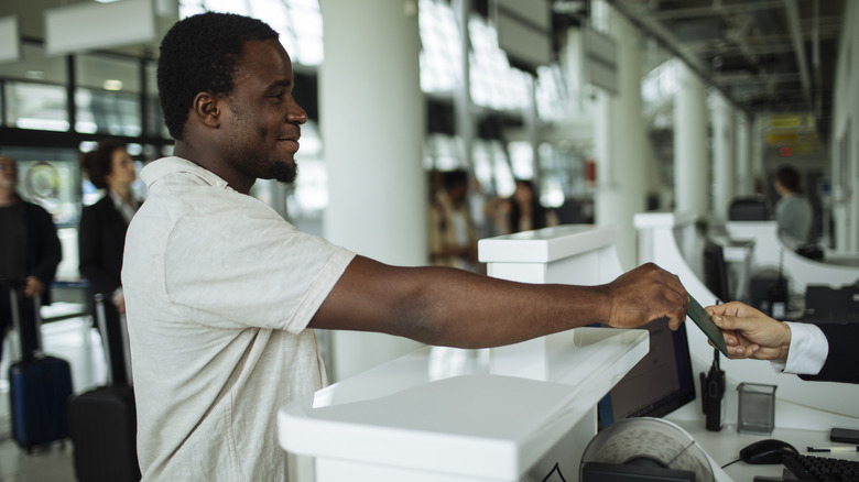 Man at airport counter