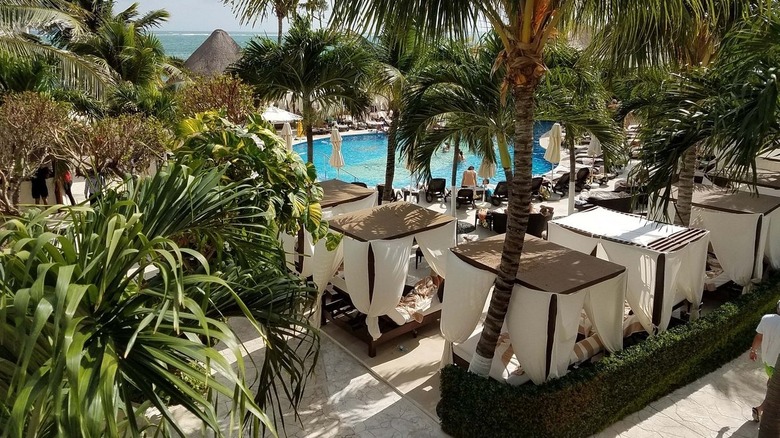 canopy beds around pool