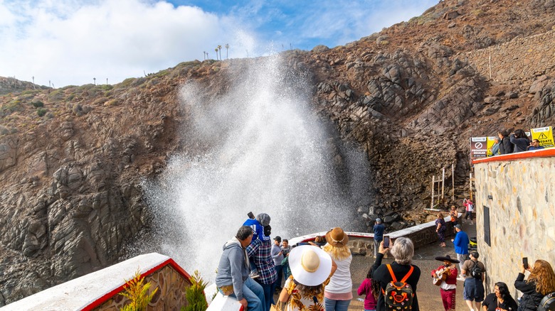 People looking at the La Bufadora geyser in Mexico