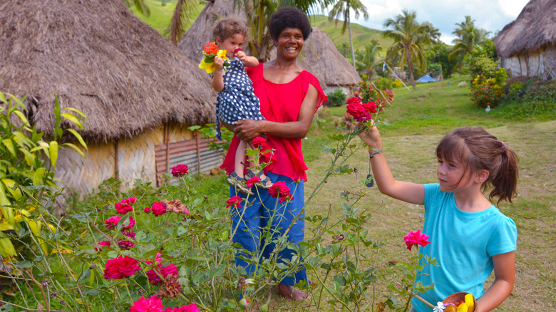 Tourists in Fiji village