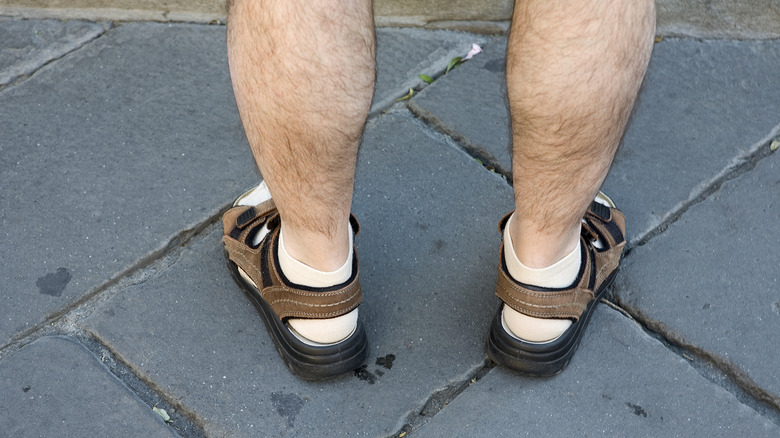 Feet in socks and sandals