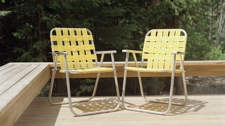 Folding chairs on wooden deck