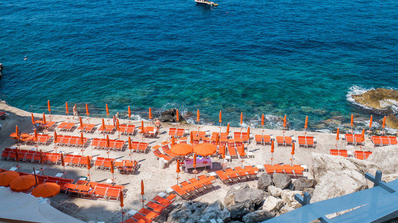 orange chairs on Gavitella Beach