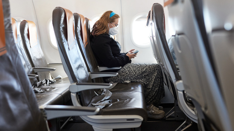 woman seated alone airplane