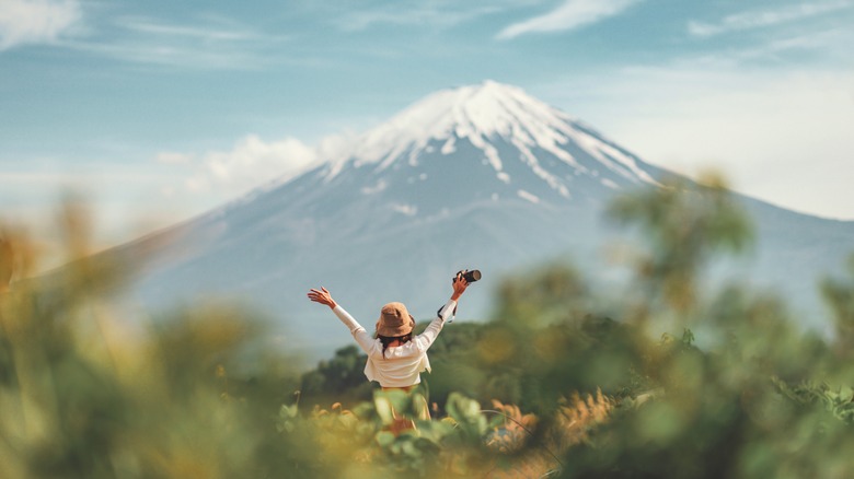 Happy woman before Mt. Fuji