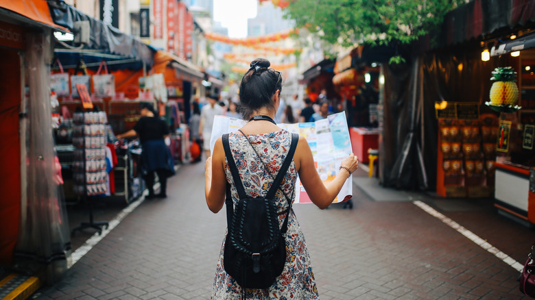 Woman wearing a backpack in Asia