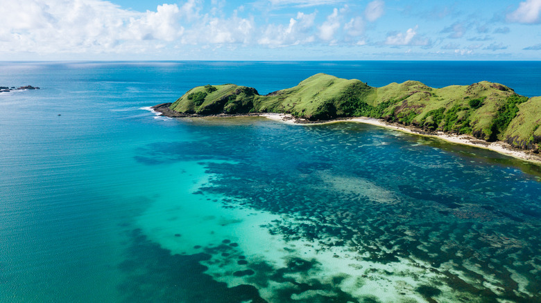 Tropical land surrounded by ocean