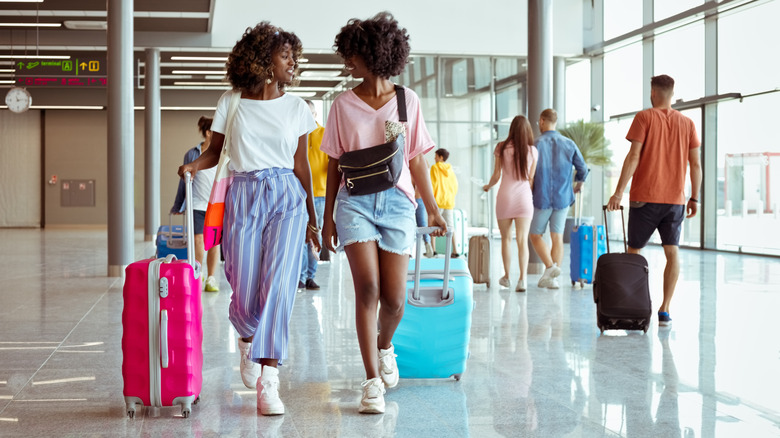 Travelers walking in an airport