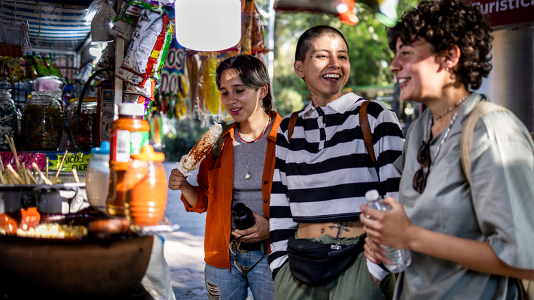 Women ordering street food in Mexico