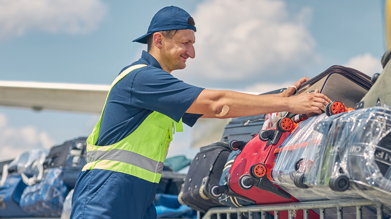 Baggage handler with suitcases