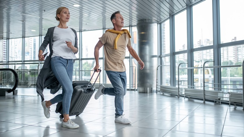 Travelers hurrying to their flight