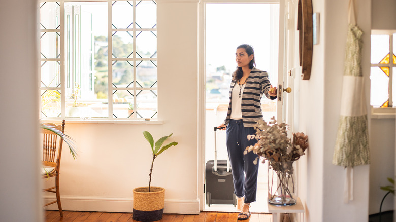 Woman entering her Airbnb