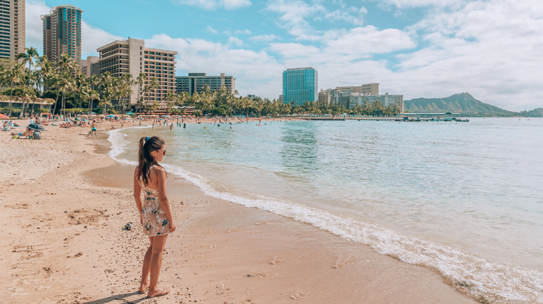 Person on beach in Hawaii in winter