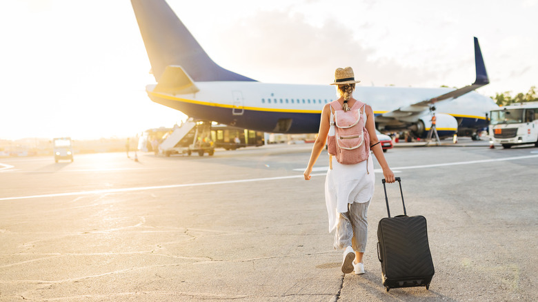 Woman walking to plane 