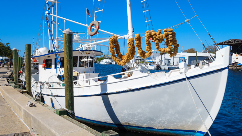 Boat resting along dock