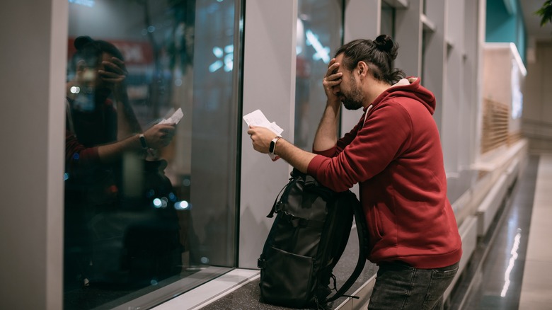 Distressed man with passport