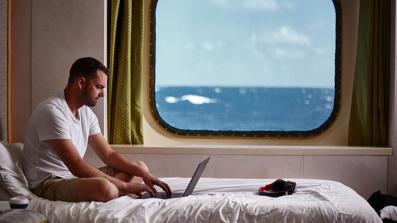 A man inside a cruise cabin