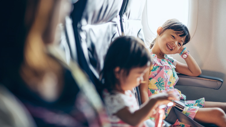 kids looking happy on flight