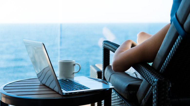 Person using their laptop in a cruise