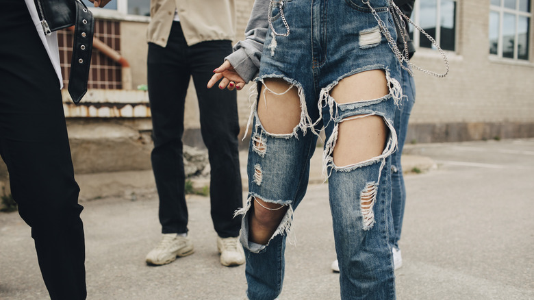 woman wearing ripped jeans