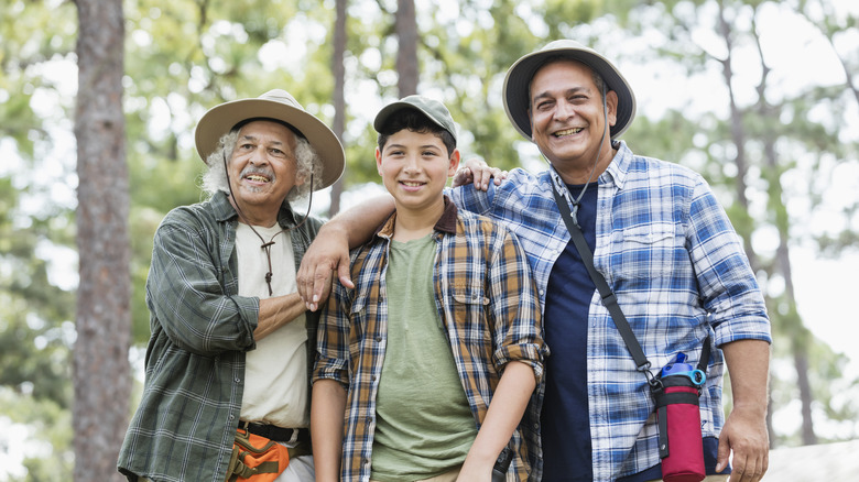 Family wearing hats while hiking