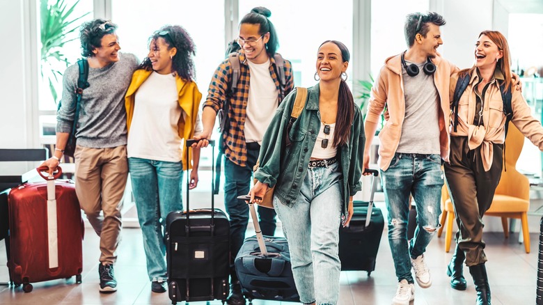 A group of travelers with suitcases