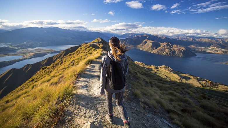 person hiking on peak