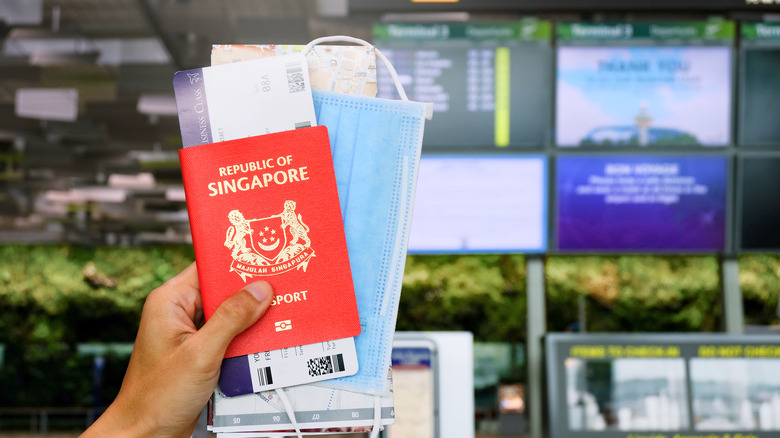 Person holding Singaporean passport