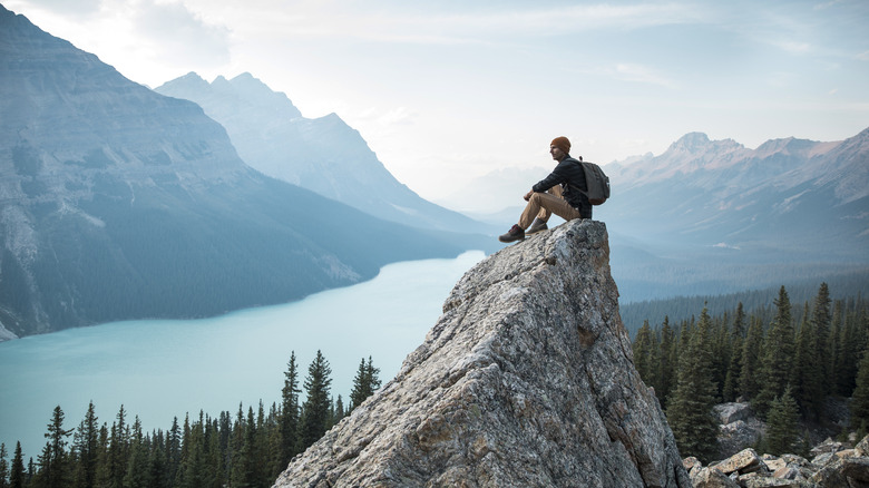 Man on Peyto Lake rock