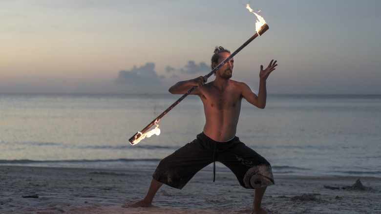 fire dancer on the beach