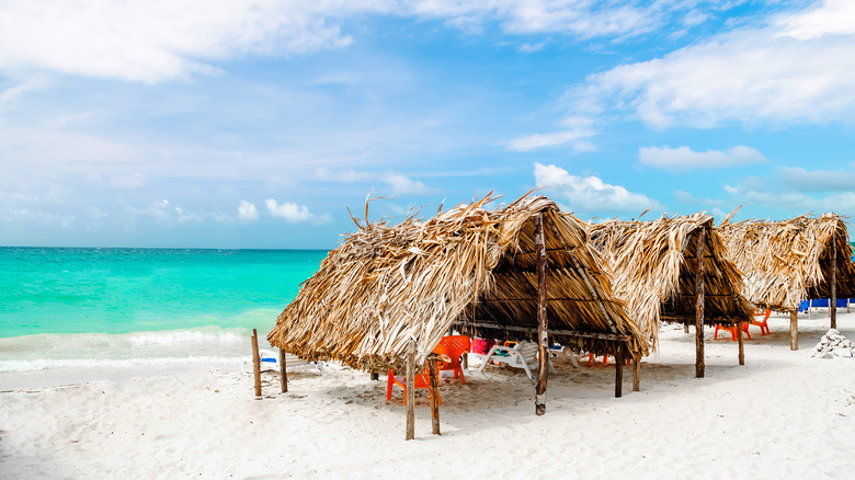 thatched cabanas at Playa Blanca on Baru