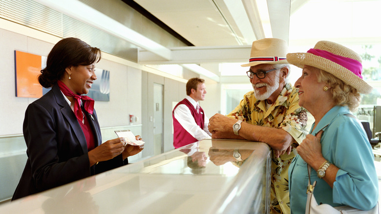 Couple at airport check-in