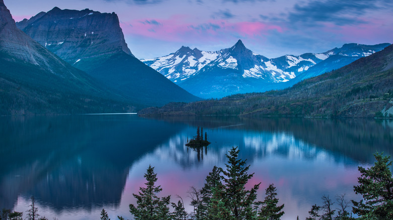 Lake with snowy mountains at dawn